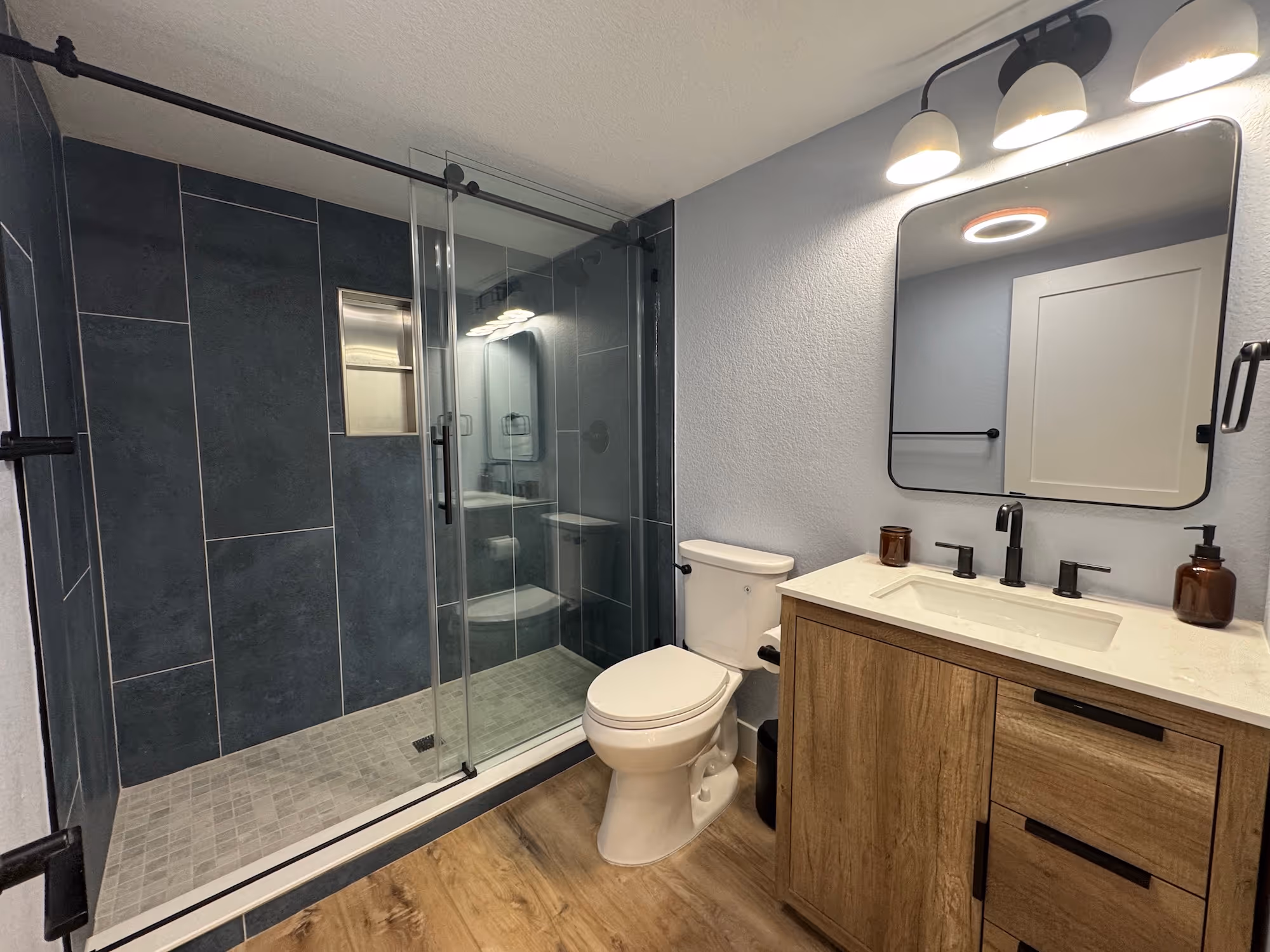 Basement kitchenette with cabinets