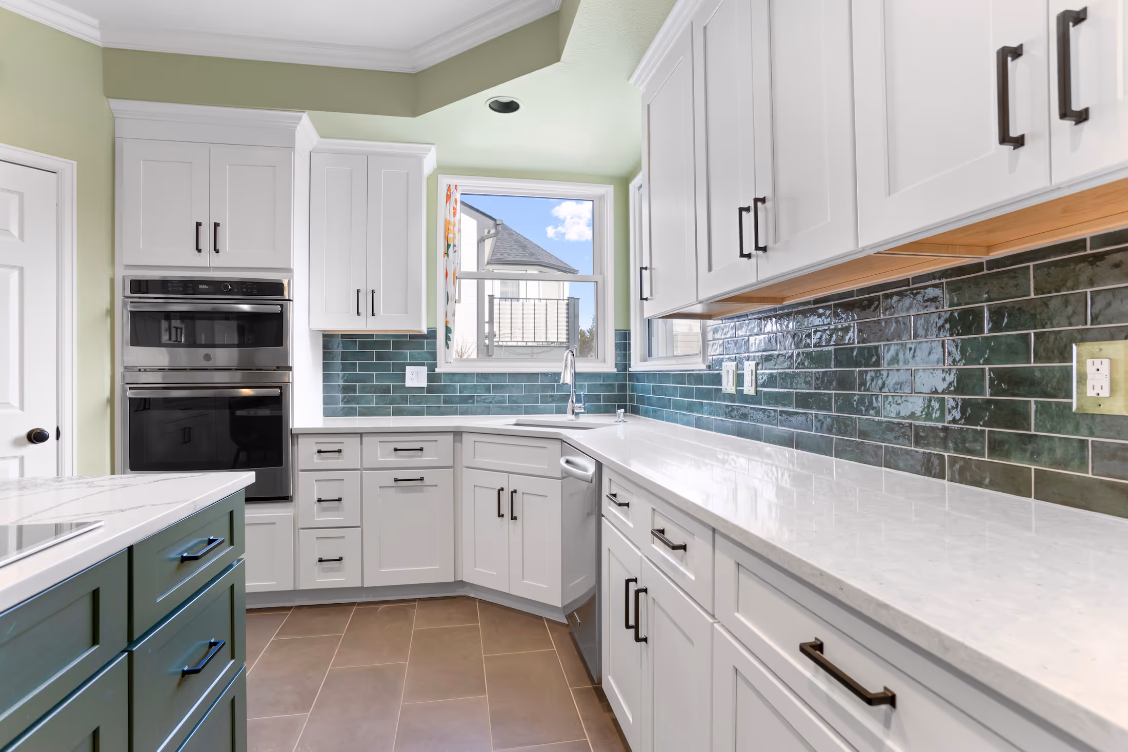 Kitchen remodel with a large island and pendant lighting
