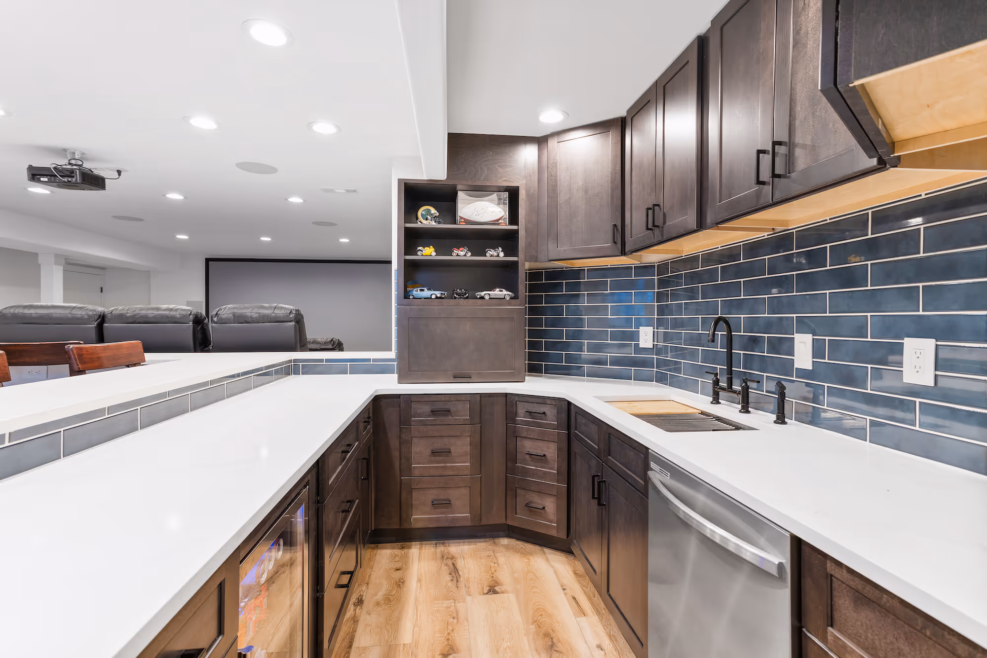 Professional cabinet painter applying a fresh coat of paint to kitchen cabinets in a home.