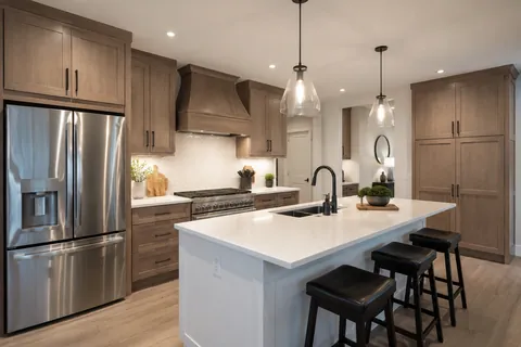 Before and after photo of a complete kitchen renovation and remodel.